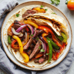 How to Make the Best Healthy Steak Fajitas That Taste Amazing healthy steak fajitas Healthy steak fajitas with grilled peppers and onions.