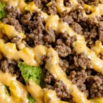 Fresh Big Mac salad with lettuce, tomatoes, and beef in a glass bowl