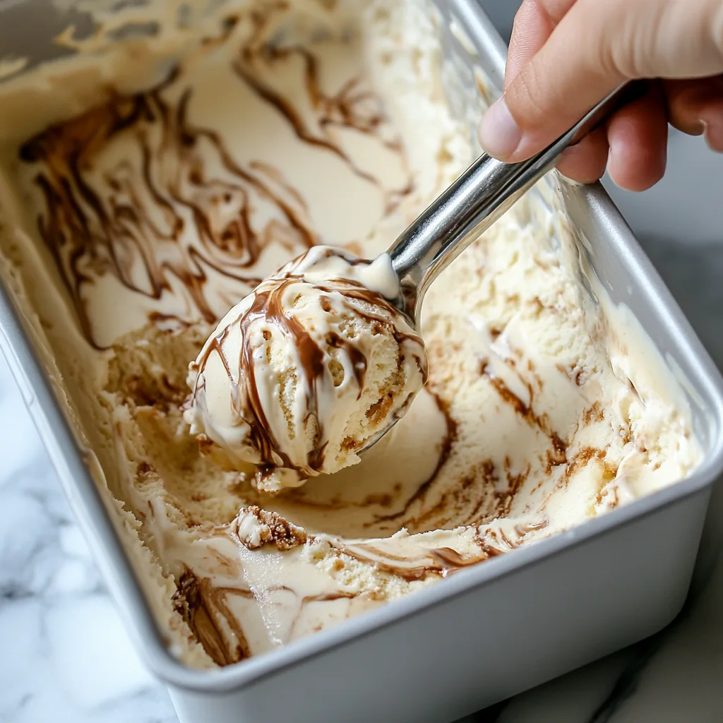 Easy Healthy Cottage Cheese Ice Cream Recipe Cottage Cheese Ice Cream Hand scooping peanut butter swirled cottage cheese ice cream from container