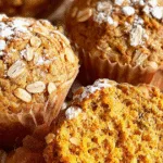 Gluten-free sweet potato waffles topped with whipped cream and raspberries